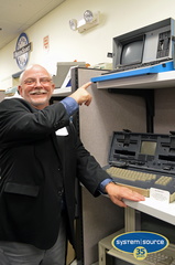 Buzz Merrick pointing to the KAYPRO II